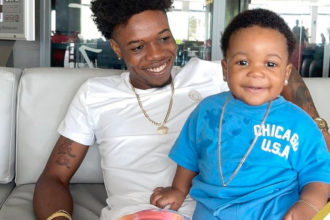 Vybz Kartel Shares Gleeful Footage Of His Grandson Playing In Wads Of Cash