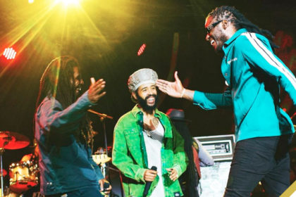 Aidonia shares a candid moment with Chronixx and Protoje at The Lost In Time Festival