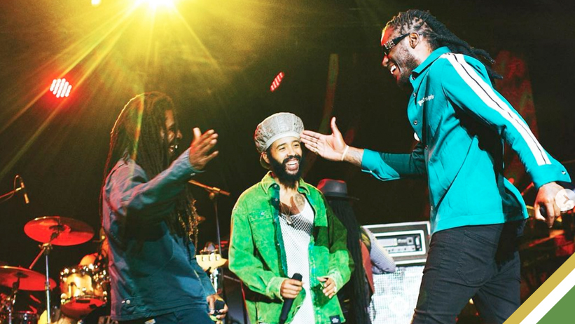 Aidonia shares a candid moment with Chronixx and Protoje at The Lost In Time Festival