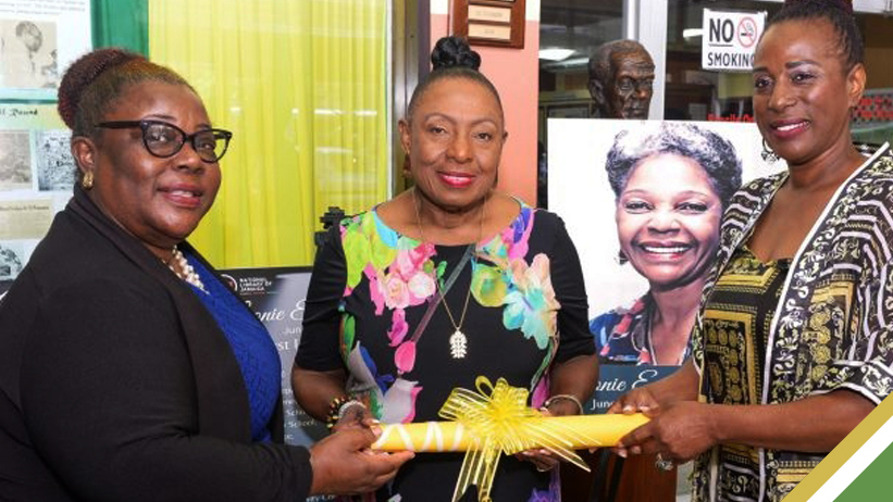 Minister of Culture, Gender, Entertainment and Sport, Hon. Olivia Grange (centre) and National Librarian at the National Library of Jamaica, Beverley Lashley (left), accept the representative deed of the Leonie Forbes Collection from Actress, Karen Harriot.