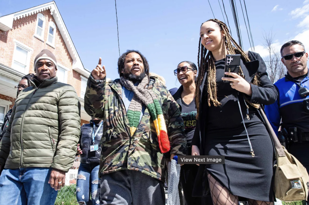 Stephen Marley, walks with community members at One Love Park/Tatnall Street Park in Wilmington