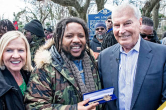 Stephen Marley, flanked by Lieutenant Governor of Delaware Bethany Hall-Long and Mayor Purzycki, holds the key to the city presented to him by Mayor Purzycki at One Love Park/Tatnall Street Park in Wilmington (Photo: Benjamin Chambers/Delaware News Journal)
