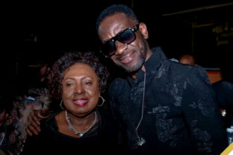 (L-R) Entertainment and Culture Minister Olivia Grange and Bounty Killer