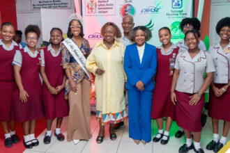 Minister of Culture, Gender, Entertainment and Sport, Hon. Oliva Grange (center), and Minister of Education, Skills, Youth & Information, Senator Dr. the Hon. Dana Morris Dixon (center), engage with members of the St. Andrew High School Occasion was the Jamaica Cultural Development Commission (JCDC) 2025 Marcus Garvey Award for Excellence in the Performing Arts presentation ceremony