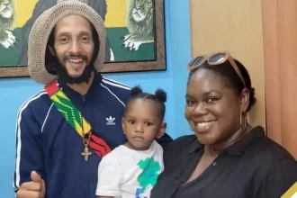Susan Smith (right) shares a photo op with daughter and Grammy-winning Reggae Singer Julian Marley