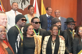 Officials from the City of Lauderhill shares a photo op with several Jamaican entertainers.