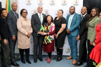VP Records Co-Founder Patricia Chin Honoured by the Embassy of Jamaica for Over 60 Years of Contribution to Jamaican Music Jamaica’s Ambassador to the United States, Major General (Ret’d) Antony Anderson (fifth left), and VP Records co-founder, Patricia “Miss Pat” Chin (centre), share a light moment with members of the Embassy of Jamaica staff after she was honoured at the Embassy’s inaugural Reggae Night on February 26 in Washington DC, in celebration of Reggae Month. (Photo Derrick Scott)